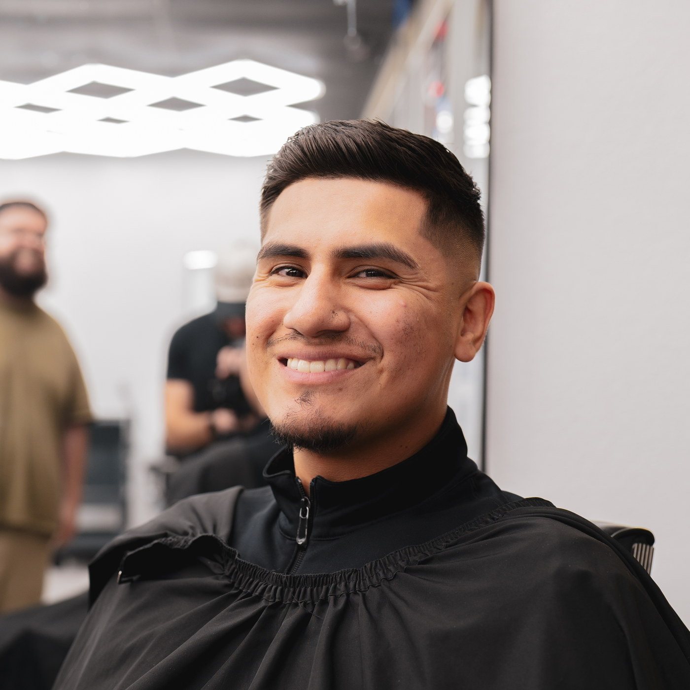 A client mid-cut in the chair at Kongo Barbershop