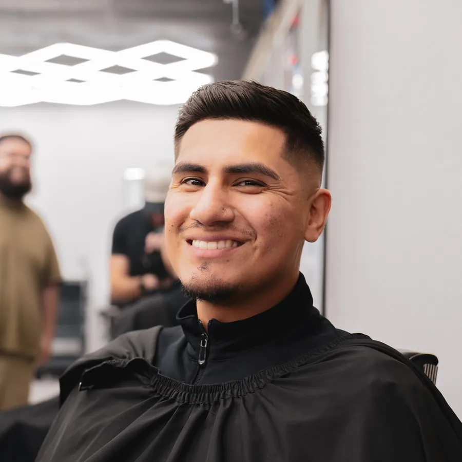 A client mid-cut in the chair at Kongo Barbershop