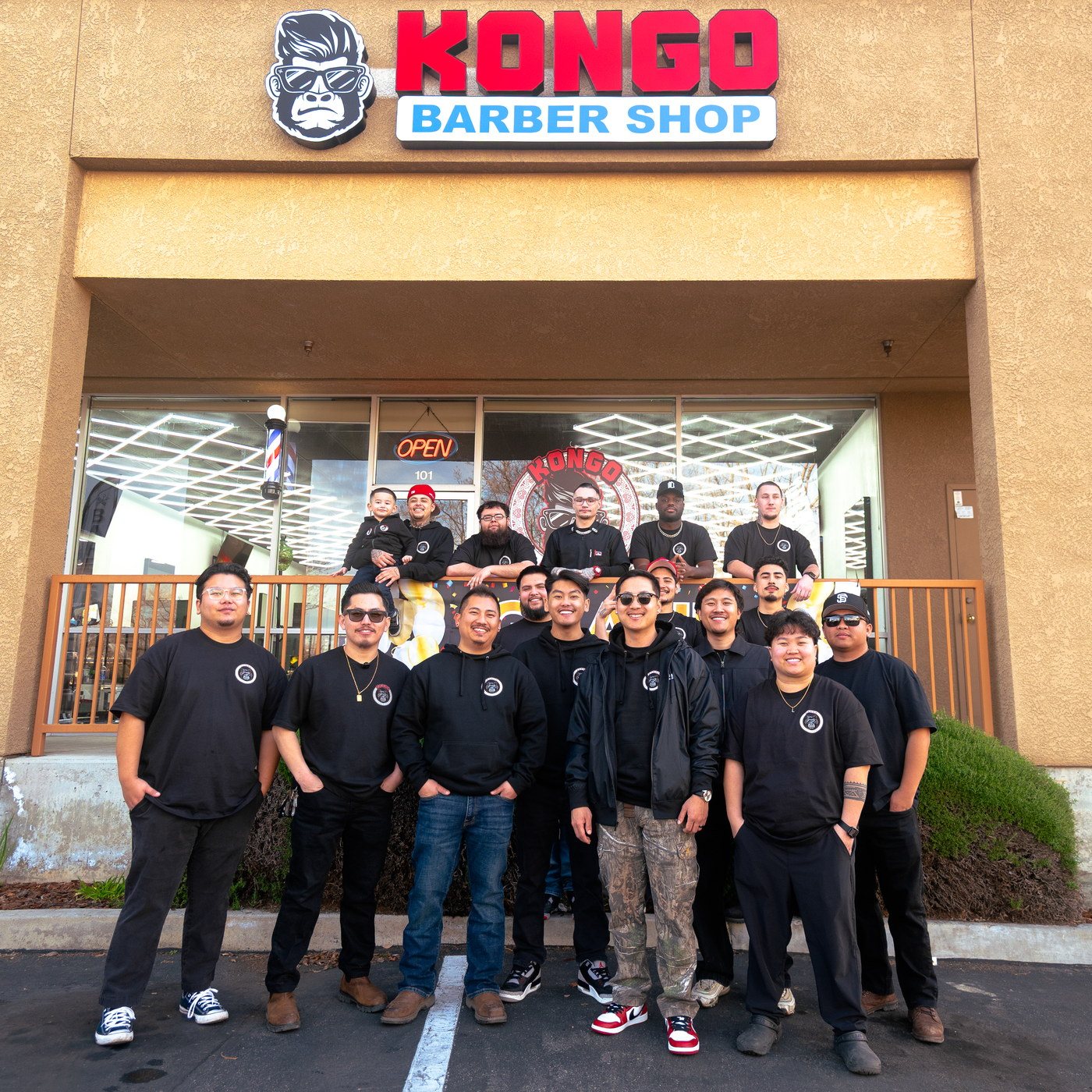 The Kongo Barbershop team outside the shop